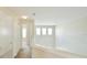 Upstairs hallway with multiple closets, carpeted floors, and natural light at 1730 Spicebush Ct, Orlando, FL 32828