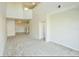 Spacious living room featuring an open floor plan and carpeted floors at 1730 Spicebush Ct, Orlando, FL 32828