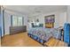 Bright bedroom with a ceiling fan and a large window for natural light at 210 Magnolia Rd # 214, Maitland, FL 32751