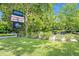 Charming establishment entrance with clear signage surrounded by lush greenery and ample parking at 210 Magnolia Rd # 214, Maitland, FL 32751