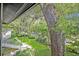 Scenic view of lush greenery and mature trees surrounding the property, creating a peaceful and inviting atmosphere at 210 Magnolia Rd # 214, Maitland, FL 32751
