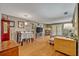 Spacious living room featuring wood floors and plenty of natural light at 210 Magnolia Rd # 214, Maitland, FL 32751