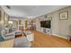 Inviting living room with an open layout and hardwood flooring at 210 Magnolia Rd # 214, Maitland, FL 32751