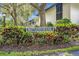 Maitland House sign surrounded by colorful bushes at 210 Magnolia Rd # 214, Maitland, FL 32751