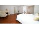 Bedroom featuring an iron bed frame, wood floors, and a fireplace at 2205 Wyndam Way, Kissimmee, FL 34743