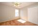 Sunlit bedroom featuring a ceiling fan and double closets for ample storage space at 2205 Wyndam Way, Kissimmee, FL 34743