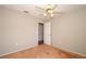 Cozy bedroom boasting a ceiling fan and an open doorway at 2205 Wyndam Way, Kissimmee, FL 34743