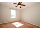 Bedroom with a ceiling fan, window and neutral walls and carpet at 2205 Wyndam Way, Kissimmee, FL 34743