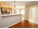 Modern kitchen with stainless steel appliances and a breakfast bar area at 2205 Wyndam Way, Kissimmee, FL 34743