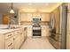 Well-equipped kitchen with stainless steel appliances and tiled backsplash at 2205 Wyndam Way, Kissimmee, FL 34743