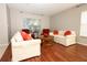 Bright living room with hardwood floors, stylish furniture, and natural light at 2205 Wyndam Way, Kissimmee, FL 34743