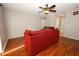 Cozy living room with natural lighting and ceiling fan at 2205 Wyndam Way, Kissimmee, FL 34743
