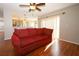 Cozy living room with hardwood floors and natural light at 2205 Wyndam Way, Kissimmee, FL 34743