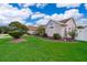 Charming single-story home featuring a well-maintained lawn and side yard landscaping at 2223 Fairmont Cir, Orlando, FL 32837