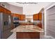 Modern kitchen featuring granite countertops, stainless steel appliances, and tile floors at 2223 Fairmont Cir, Orlando, FL 32837