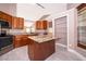 Updated kitchen with granite countertops, stainless steel appliances, and ample storage at 2223 Fairmont Cir, Orlando, FL 32837