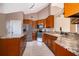 Modern kitchen featuring granite countertops, stainless steel appliances and an island at 2223 Fairmont Cir, Orlando, FL 32837
