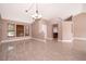 Spacious living room featuring tile floors, vaulted ceilings, and neutral paint at 2223 Fairmont Cir, Orlando, FL 32837