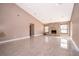 Large living room with tile floors, neutral colors, recessed lights, and fireplace at 2223 Fairmont Cir, Orlando, FL 32837