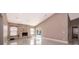 Spacious living room features a stone fireplace and sliding glass doors to the patio at 2223 Fairmont Cir, Orlando, FL 32837
