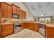 Well-equipped kitchen featuring stainless steel appliances, granite countertops, and plenty of natural light at 2265 Turnberry Dr, Oviedo, FL 32765