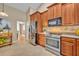 Functional kitchen featuring stainless steel appliances, ample counter space, and easy access to the dining area at 2265 Turnberry Dr, Oviedo, FL 32765