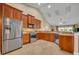 Modern kitchen with stainless steel appliances, ample cabinet space, and an open design overlooking the living area at 2265 Turnberry Dr, Oviedo, FL 32765