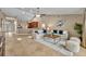 Spacious living room connected to the kitchen with tile flooring and an open layout, great for gatherings at 2265 Turnberry Dr, Oviedo, FL 32765