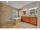Modern main bathroom with a glass shower, soaking tub, and double vanities at 2265 Turnberry Dr, Oviedo, FL 32765