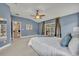 Large main bedroom features a king bed, sliding glass doors, and ceiling fan at 2265 Turnberry Dr, Oviedo, FL 32765