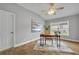 Well-lit office with a contemporary desk, comfortable chair, and hardwood floors at 2265 Turnberry Dr, Oviedo, FL 32765