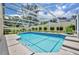 Beautifully designed pool with screened enclosure, lush landscaping, and a serene backyard setting at 2265 Turnberry Dr, Oviedo, FL 32765