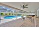 Enjoy the screened patio with a view of the pool, hot tub and landscaped yard, perfect for outdoor lounging at 2265 Turnberry Dr, Oviedo, FL 32765