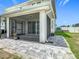 Paver patio, screen porch and backyard showing the outdoor kitchen with a beautiful, fenced-in backyard at 242 White Heron Way, St Cloud, FL 34772