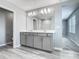 Bathroom with double vanity and glass shower enclosure at 242 White Heron Way, St Cloud, FL 34772