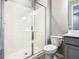 Bathroom featuring a toilet and glass shower at 242 White Heron Way, St Cloud, FL 34772