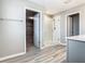 Bathroom featuring glass-enclosed shower and open walk-in closet at 242 White Heron Way, St Cloud, FL 34772