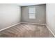 Bedroom featuring neutral walls, carpeted flooring, and a window with blinds at 242 White Heron Way, St Cloud, FL 34772