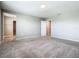 Bright bedroom featuring plush carpeting and view to walk-in closet at 242 White Heron Way, St Cloud, FL 34772