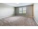 Carpeted bedroom with natural light streaming through the windows at 242 White Heron Way, St Cloud, FL 34772