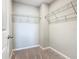 A walk-in closet with wire shelving and neutral carpeting at 242 White Heron Way, St Cloud, FL 34772
