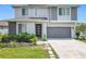 Inviting two-story home with modern design, well-maintained landscaping, and a convenient two-car garage at 242 White Heron Way, St Cloud, FL 34772