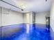 Garage featuring an epoxy floor and doorway to the home's interior at 242 White Heron Way, St Cloud, FL 34772