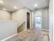 Upstairs hallway with carpet and access to several bedrooms at 242 White Heron Way, St Cloud, FL 34772