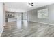 Bright and spacious living room with sliding glass doors and wood-look flooring at 242 White Heron Way, St Cloud, FL 34772