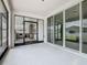 Spacious covered patio area with an outdoor kitchen, barbecue, and glass sliding doors at 242 White Heron Way, St Cloud, FL 34772