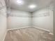 Spacious walk-in closet featuring installed shelving and neutral carpet at 242 White Heron Way, St Cloud, FL 34772