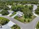 Charming home features mature landscaping, screen lanai, and extra long driveway at 25333 Casa Del Lago Ln, Leesburg, FL 34748