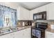 A kitchen showcasing stainless steel appliances and granite countertops at 25333 Casa Del Lago Ln, Leesburg, FL 34748
