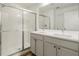 Bright bathroom with a double sink vanity and tiled shower with glass enclosure at 2918 Rodrick Cir, Orlando, FL 32824